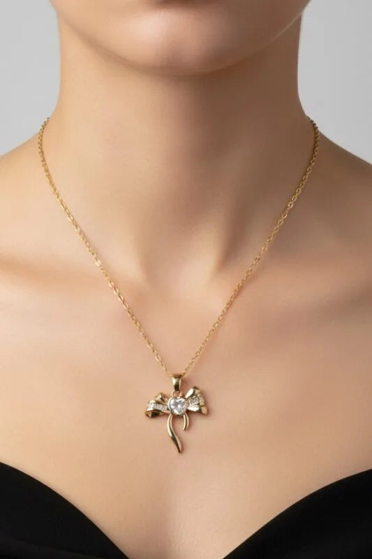 Altın Renk Kalp Fiyonk Beyaz Taş Çelik Kolye